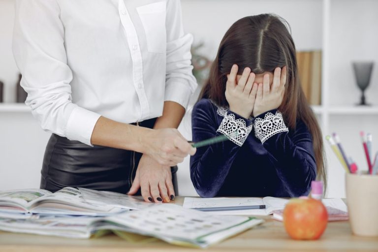 A supportive parent watches their child learn how to handle mistakes during play.