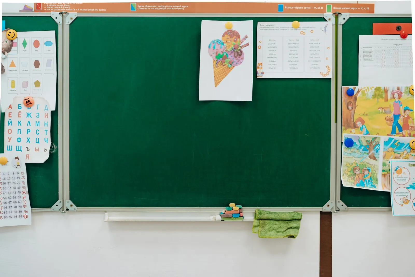 Three clear plastic bins hold picture cards for teaching kids needs and wants.